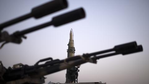 An Iranian long range surface to surface Qadr missile and an anti-aircraft gun are displayed in a war exhibition organized by the Islamic Revolutionary Guard Corps in a park in southern Tehran to mark the anniversary of the Iran-Iraq war on September 23, 2021. (Morteza Nikoubazl/NurPhoto via Getty Images)