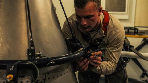 Missile maintainers tear down an ICBM for Maintenance