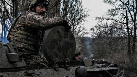 Ukrainian servicemen move towards the front line near Bakhmut, Ukraine, on March 8, 2023. (Sergey Shestak/AFP via Getty Images)