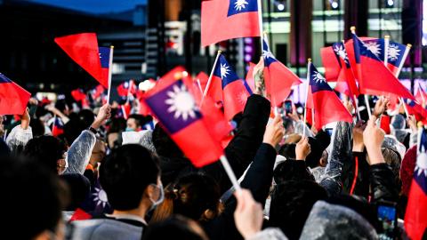 People wave Taiwanese flags in front of the Presidential Office Building of Taiwan on January 1, 2023, in Taipei, Taiwan. (Gene Wang/Getty Images)