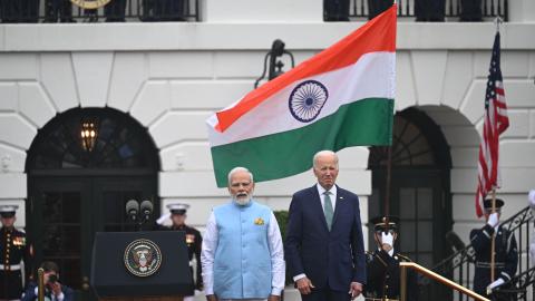 US President Joe Biden and India's Prime Minister Narendra Modi listen to the national anthems during a welcoming ceremony for Modi on the South Lawn of the White House in Washington, DC, on June 22, 2023. (Andrew Caballero-Reynolds/AFP via Getty Images)