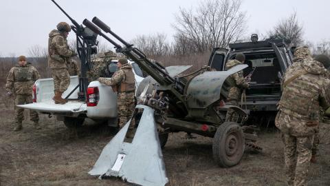 Air Defence Ukrainian servicemen, who took part in the defence operations during recent attacks on Kyiv, prepare their weapons near Kyiv on January 3, 2024, amid the Russian invasion of Ukraine. Deadly air strikes hit residential buildings in Ukraine on January 2, 2024, in an escalation of aerial attacks that killed five people and 130 wounded. (Photo by Anatolii STEPANOV / AFP) (Photo by ANATOLII STEPANOV/AFP via Getty Images)