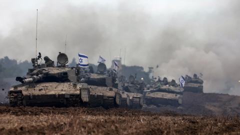 A unit of Israeli soldiers returns to the Israeli side of the border with the Gaza Strip on January 28, 2024. (Photo by Menahem Kahana/AFP via Getty Images)