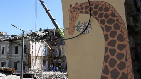 Emergency and rescue personnel clear the rubble of the destroyed building of Ohmatdyt Children's Hospital after a missile attack in Kyiv on July 9, 2024. (Anatolii Stepanov/AFP via Getty Images)