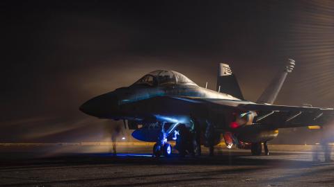 Sailors prepare an E/A-18G Growler for launch aboard the USS Dwight D. Eisenhower in the Red Sea on April 16, 2024. (DVIDS)