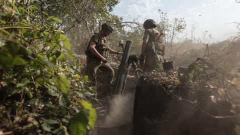 Ukrainian soldiers fire a mortar in the direction of Kreminna, Ukraine, on August 26, 2024. (Diego Herrera Carcedo/Anadolu via Getty Images)