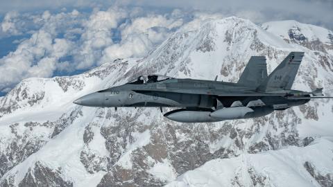 North American Aerospace Defense Command CF-18 Hornet flies in formation with a KC-135 Stratotanker after escorting a B-52 Stratofortress across Northern Alaska, June 18, 2024. (DVIDS)