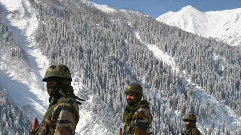 Indian army soldiers walk near Zojila mountain pass that connects Srinagar to Ladakh on February 28, 2021. (Tauseef Mustafa/AFP via Getty Images)