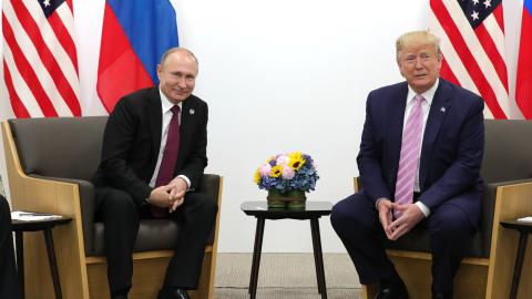 US President Donald Trump (R) meets Russian President Vladimir Putin (L) on the first day of the G20 summit in Osaka, Japan on June 28, 2019. (Photo by Kremlin Press Office / Handout/Anadolu Agency/Getty Images)