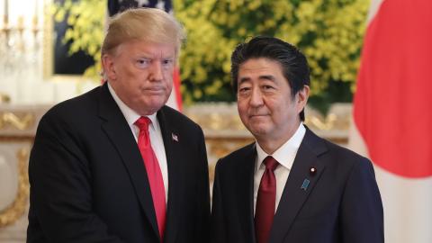 President Donald Trump and Shinzo Abe shake hands prior to their meeting on May 27, 2019, in Tokyo, Japan. (Eugene Hoshiko via Getty Images)