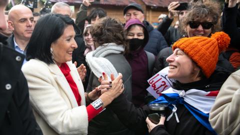 President Salome Zourabichvili greets a supporter outside her residence in Tbilisi, following the inauguration of the newly elected president, Mikheil Kavelashvili.  (Photo by Jay Kogler/SOPA Images/LightRocket via Getty Images)