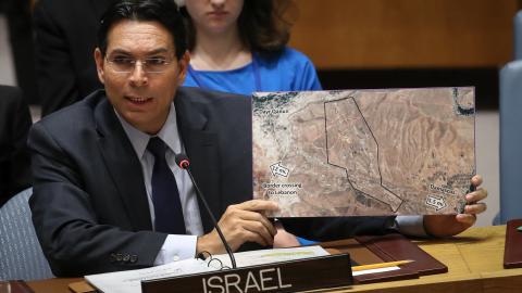 Israeli ambassador to the United Nations Danny Danon holds a map during a United Nations Security Council meeting concerning the situation in the Middle East on April 26, 2018, in New York City. (Drew Angerer via Getty Images)