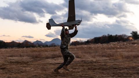 U.S. Marine Corps Cpl. Jakob Santos, a small unmanned aerial system operator with 4th Marines, 3d Marine Division, prepares to launch a RQ-20B Puma during Artillery Relocation Training Program 24.3 at Ojojihara Maneuver Area, Miyagi Prefecture, Japan, Nov. 29, 2024. Unmanned aircraft provide enhanced situational awareness, quick resupply capabilities, and reduce the footprint of military personnel. The skills developed at ARTP increase the proficiency and readiness of the only permanently forward-deployed a