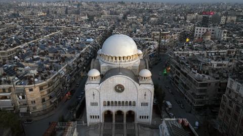 This aerial view shows the Greek Catholic Cathedral of St George, in the northern Syrian city of Aleppo, on December 3, 2024. On November 27, the Islamist Hayat Tahrir al-Sham (HTS) alliance led a major offensive snatching Syria's second city Aleppo and dozens of towns and villages from government control, after years of regime gains in successive Russian-backed military campaigns. (Photo by Omar HAJ KADOUR / AFP) (Photo by OMAR HAJ KADOUR/AFP via Getty Images)