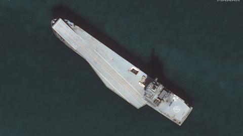 Maxar satellite imagery from December 12, 2024, of Iran's new drone ship (known as the Shahid Bagheri) is anchored offshore of the Iranian naval port of Bandar Abbas in the Persian Gulf. (Maxar Technologies via Getty Images)