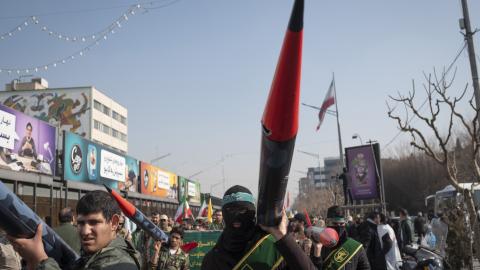 Members of the Basij paramilitary force under the command of the Islamic Revolutionary Guard Corps (IRGC) carry scale model missiles in a military rally in downtown Tehran, Iran, on January 10, 2025. (Photo by Morteza Nikoubazl/NurPhoto via Getty Images)