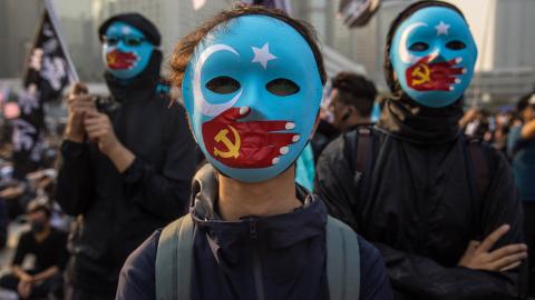 Protesters attend a rally in Hong Kong on December 22, 2019, to show support for the Uyghur minority in China. Dale DE LA REY / AFP via Getty Images)