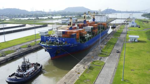 A cargo ship and tugboat sail through the Cocoli Locks in the Panama Canal on August 12, 2024. (Getty Images)