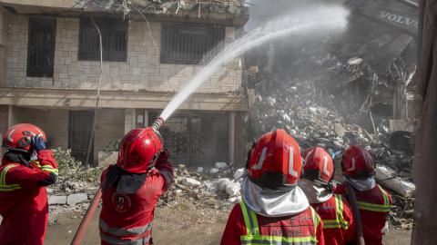 Firefighters extinguish a fire in a building that was destroyed in an Israeli attack on June 13, 2025, in Tehran, Iran. (Majid Saeedi via Getty Images)