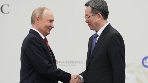 Russia's President Vladimir Putin shakes hands Chinese Vice Premier Ding Xuexiang during the Saint Petersburg International Economic Forum in Saint Petersburg on June 20, 2025. (Dmitry Lovetsky via Getty Images)