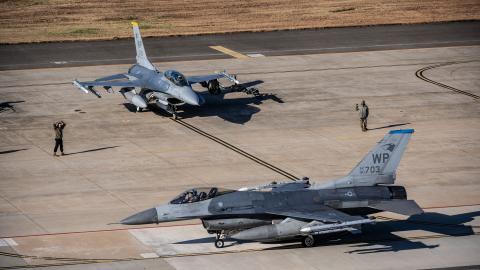Two U.S. Air Force F-16 Fighting Falcons from the 35th Fighter Squadron prepare to taxi down the runway at Kunsan Air Base, Republic of Korea, Nov. 21, 2025. With the movement of 8th Fighter Wing’s F-16s from Kunsan AB to Osan AB during the Super Squadron Phase 2 test the 8th FW will continue to operate as a primary exercise and rotational force bed-down location for U.S. air component forces in the ROK. (U.S. Air Force photo by Tech. Sgt. Giovanni Sims)