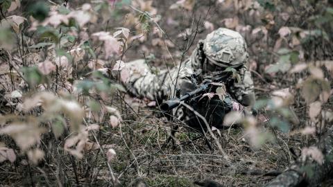 A Ukrainian soldier takes aim with a machine gun during a military training on October 21, 2025 in Kyiv Oblast, Ukraine. Despite the fourth year of the full-scale Russo-Ukrainian war, the hostilities do not cease. Every day, Ukraine’s frontlines require new qualified soldiers - well-trained, prepared for modern challenges, and technically equipped. That is why the training of Ukrainian defenders remains one of the key priorities in strengthening the country’s defense capability. (Photo by Zinchenko/Global I
