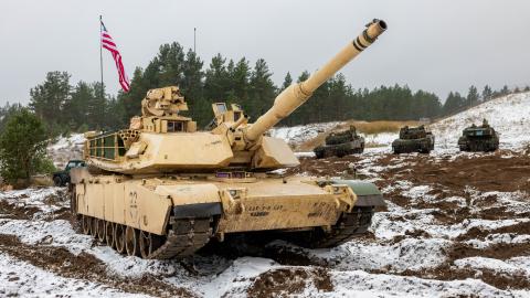 U.S. Soldiers from Battle Company, 3rd Battalion, 8th Cavalry Regiment, prepare to stage a M1A2 SEP Version 3 Abrams tank for ammunition supply during the Iron Spear Tank Competition in Adazi, Latvia, on Nov. 19, 2025. Two armor crews from Battle Company represented the U.S. Army in a multinational tank competition, which aims to strengthen convergence, enhance readiness, and increase lethality across NATO partnerships. This portion of the competition tested the crews’ knowledge and physical skills by putti
