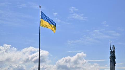 This photograph showsthe Ukrainian flag and the Motherland Monument (R) in Kyiv on August 23, 2025, a day before the Independence Day of Ukraine, amid Russian invasion in Ukraine. (Photo by Sergei SUPINSKY / AFP) (Photo by SERGEI SUPINSKY/AFP via Getty Images)