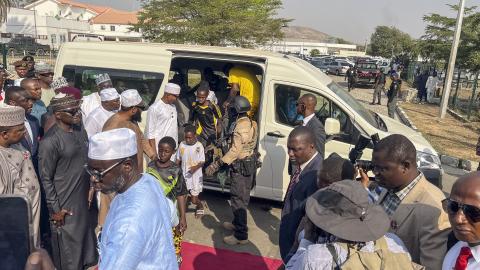 Children who were released after being kidnapped get out of a minibus upon their arrival at the Niger State Government House in Minna, Nigeria, on December 22, 2025. (Getty Images)