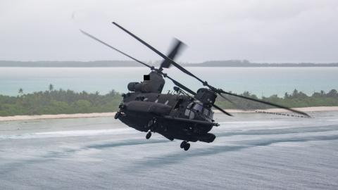 A MH-47G Chinook flies over Diego Garcia on October 14, 2025. (US Navy)