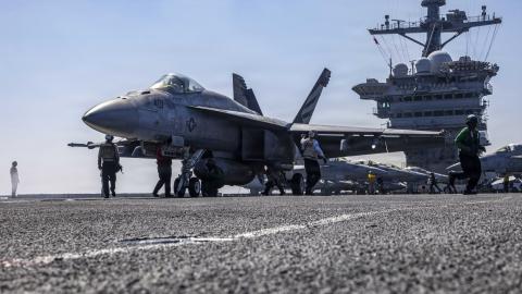 An F/A-18E Super Hornet prepares to launch from the flight deck of the USS Abraham Lincoln in the Arabian Sea on February 15, 2026. (US Navy)
