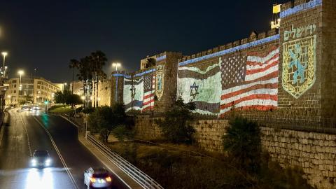 A photo shows US and Israeli flags projected on the historic walls of the Old City near Hebron Gate in Jerusalem after the United States carried out airstrikes on Iran's nuclear sites on June 22, 2025. (Photo by Gazi Samad/Anadolu via Getty Images)