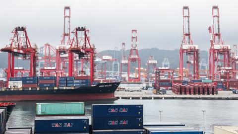 Gantry cranes and shipping containers are seen at the port in Keelung on January 16, 2026. The United States said on January 15 that it has signed a deal with Taiwan to reduce tariffs on goods from the democratic island, while increasing Taiwanese semiconductor and tech companies' investments in America. (Photo by I-Hwa Cheng / AFP via Getty Images)