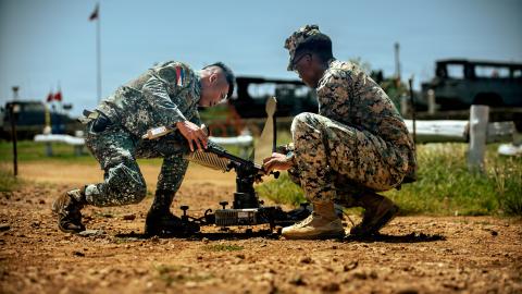 Philippine Marine Corps Staff Sgt. Lhardnernomer Sales, left, the communications noncommissioned officer in charge of 4th Marine Brigade, and U.S. Marine Corps Cpl. Donya Grady, a satellite transmissions operator assigned to Marine Rotational Force-Southeast Asia, I Marine Expeditionary Unit, set up a Viasat Multi-Mission Terminal during a staff exercise at Marine Base Camp Cape Bojeador, Philippines, Oct. 7, 2025. The MMT provides MRF-SEA with secure, high-bandwidth satellite communications for real-time d