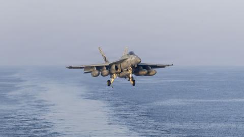 A U.S. Navy F/A-18E Super Hornet, attached to Strike Fighter Squadron (VFA) 14, prepares to make an arrested landing on the flight deck of Nimitz-class aircraft carrier USS Abraham Lincoln (CVN 72) in support of Operation Epic Fury, March 16, 2026. (U.S. Navy photo)