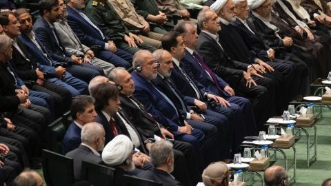 Iranian President Masoud Pezeshkian sits beside Iranian officials and other leaders during his swearing-in ceremony in Tehran on July 30, 2024. On the first row, second to the left, is Georgian Prime Minister Irakli Kobakhidze. (Getty Images)