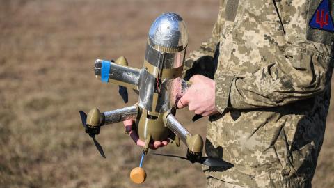 A Ukrainian soldier holds an interceptor drone as his unit carries out combat missions in Ukraine on March 4, 2026. (Getty Images)
