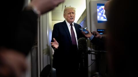 President Donald Trump speaks to members of the media on board Air Force One on March 15, 2026. (Getty Images)