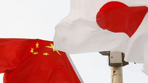 Chinese and Japanese national flags fly in Tiananmen Square before a welcoming ceremony for Japan's new Prime Minister Shinzo Abe October 8, 2006 in Beijing, China. (China Photos/Getty Images)