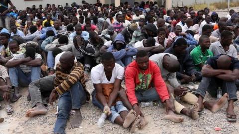 Migrants from sub-Saharan Africa rest inside a detention center in the Libyan capital Tripoli on June 4, 2015. (MAHMUD TURKIA/AFP/Getty Images)