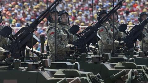 Chinese soldiers pass in front of Tiananmen Square and the Forbidden City during a military parade on September 3, 2015 in Beijing, China. (Kevin Frayer/Getty Images)