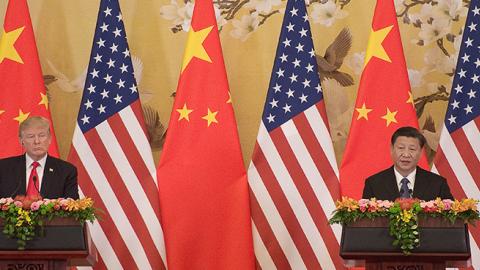 U.S. President Donald Trump and China's President Xi Jinping speak during a joint statement in Beijing on November 9, 2017. (Photo credit: NICOLAS ASFOURI/AFP/Getty Images)