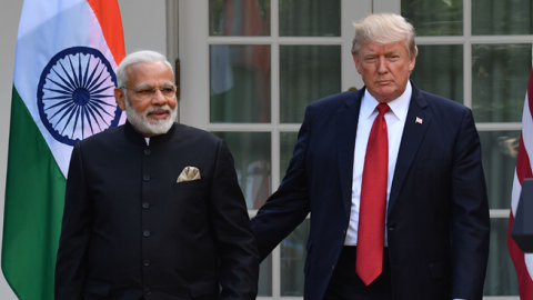 US President Donald Trump guides Indian Prime Minister Narendra Modi towards a joint press conference at The White House on June 26, 2017. (NICHOLAS KAMM/Getty Images)