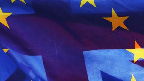Flags of the European Union and Great Britain fly together on College Green near the Palace of Westminster. (Jonathan Brady/PA Images via Getty Images)