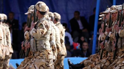 Iranian Army soldiers march past President Hassan Rouhani during the Army Day parade in Tehran on April 18, 2015. (Getty Images)