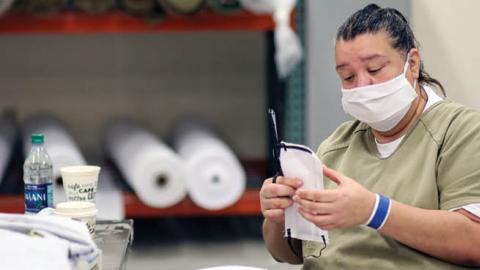 An inmate sews protective masks at Las Colinas Women's Detention Facility in Santee, California, on  April 22, 2020. 