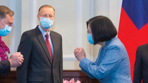 Taiwan's President Tsai Ing-wen gestures to a US official as US Secretary of Health and Human Services Alex Azar and director of the American of Institute in Taiwan, Brent Christensen, look on during their visit to the Presidential Office in Taipei