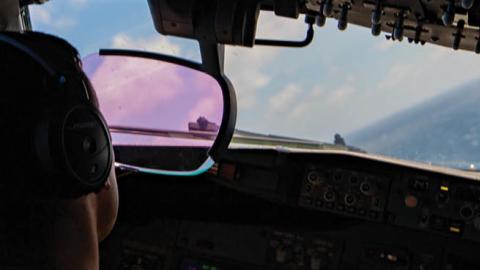 A pilot with the “Grey Knights” of VP-46 flies a P8-A Poseidon during intelligence surveillance reconnaissance drills on July 17, 2020.