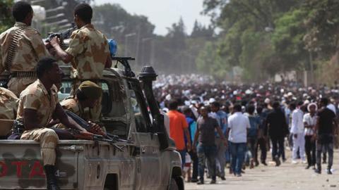 Oromo regional police officers wait in a pick up car during the Oromo new year holiday Irreechaa in Bishoftu on October 2, 2016 (ZACHARIAS ABUBEKER/AFP via Getty Images)