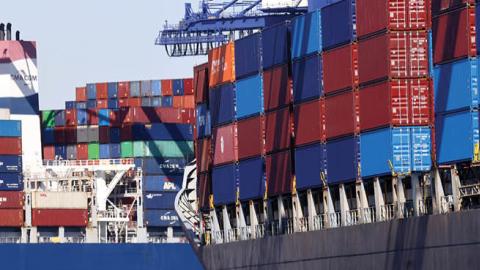 Cargo containers sit stacked on ships at the Port of Los Angeles, the nation’s busiest container port, on October 15, 2021 in San Pedro, California. (Photo by Mario Tama/Getty Images)